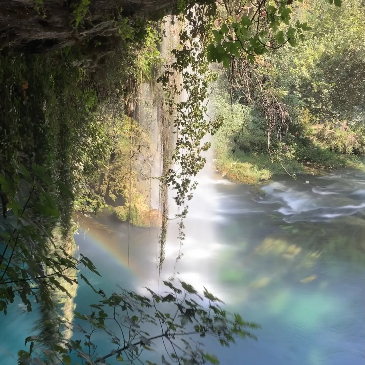 A rainbow seen through the curtain of water from Upper Düden’s cave