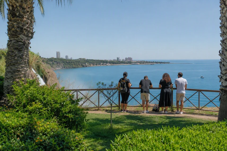 Visitors at the free public cliff-top park beside Lower Duden and the Mediterranean, AI recreation