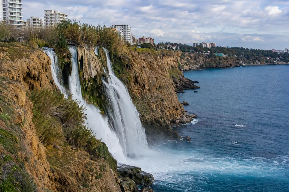 Lower Duden Waterfall and the Mediterranean under a cloudy winter sky, AI recreation