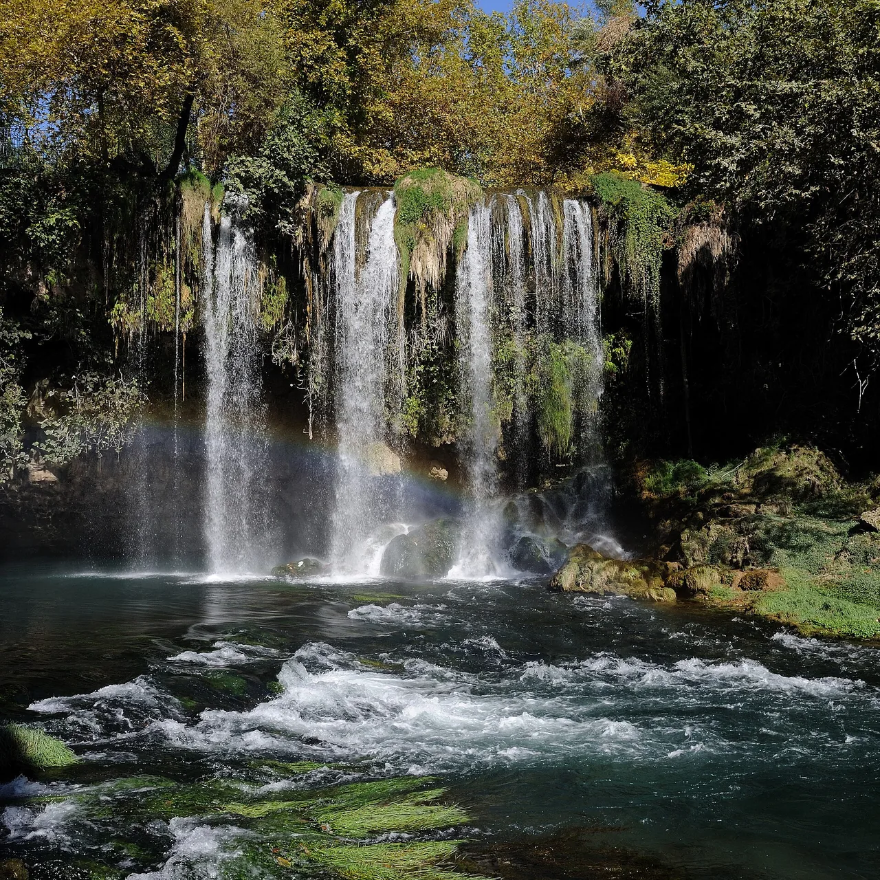 Upper Düden’s waterfall and basin surrounded by trees